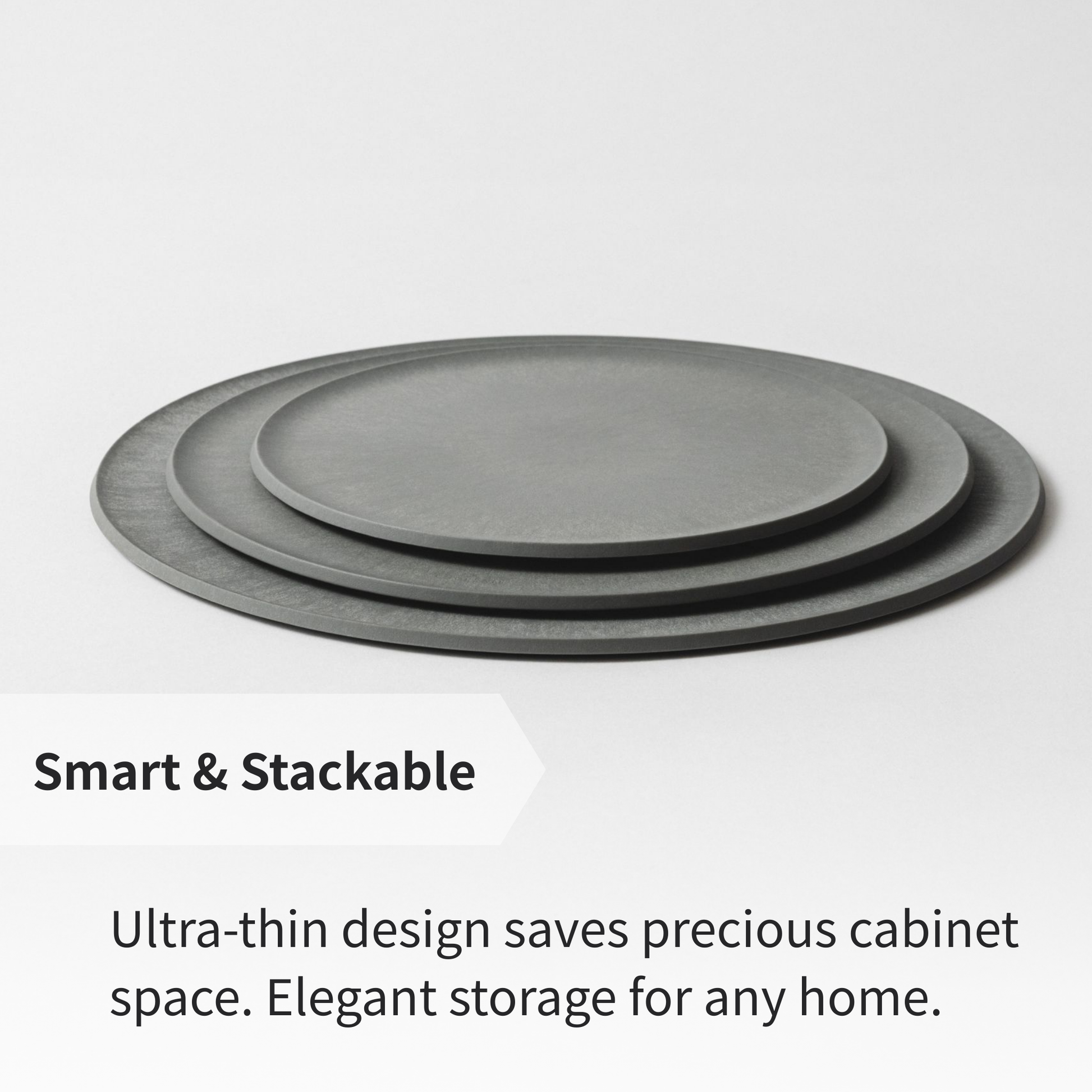 CHOPLATE plates stacked together, demonstrating space-saving storage for compact kitchens.