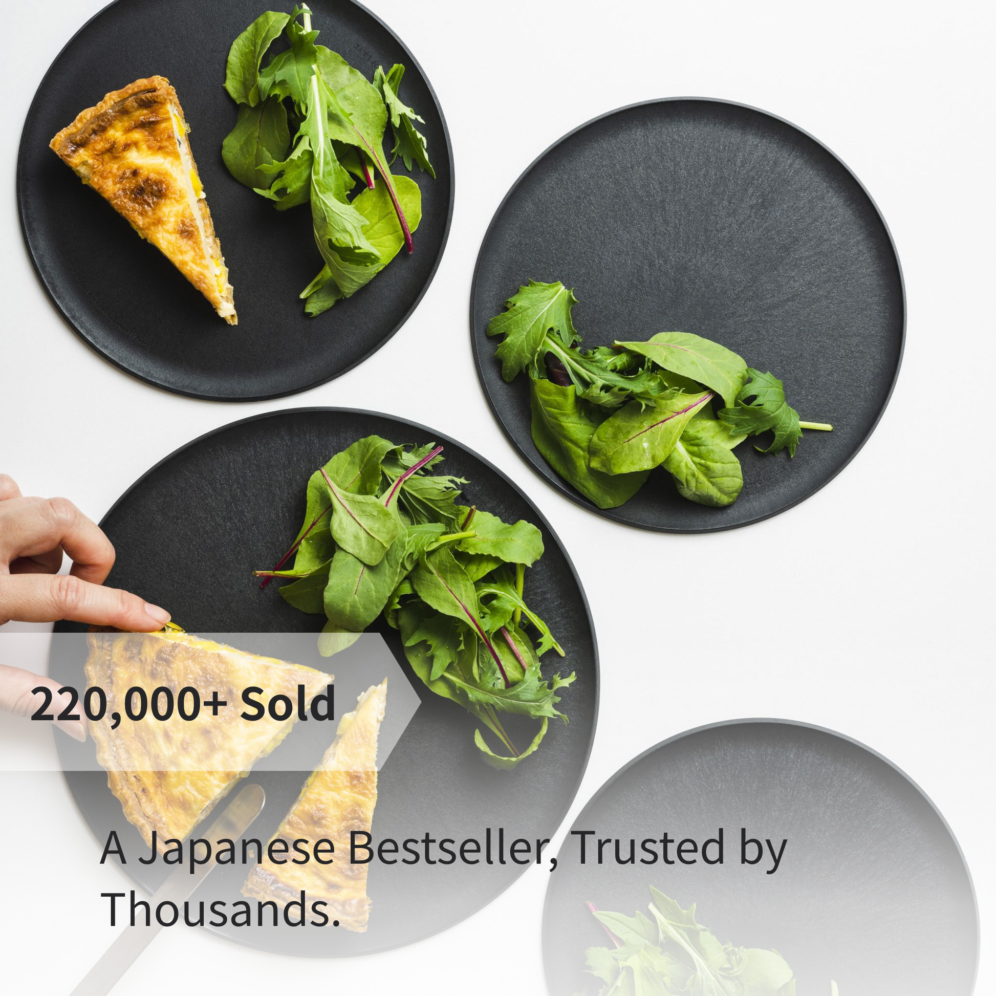 Plating quiche and salad on a CHOPLATE, showing its versatility from kitchen preparation to dining table.